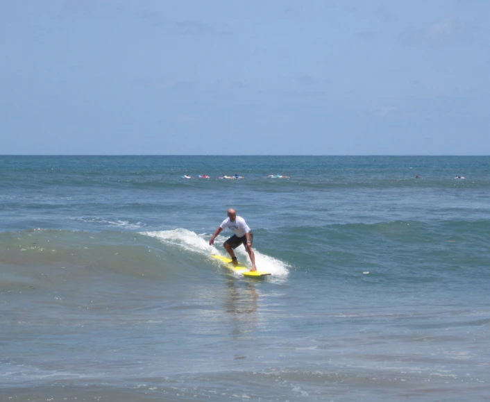 a man surfing in the water on his surfboard