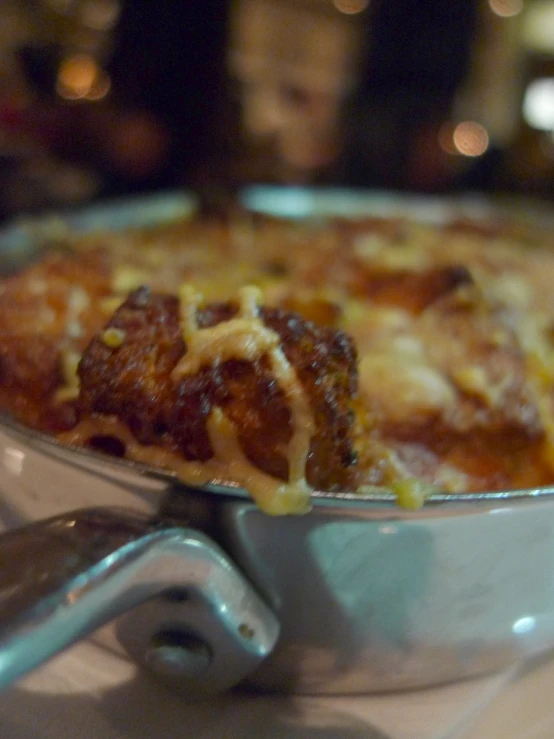 a close up image of a pan of food in a restaurant