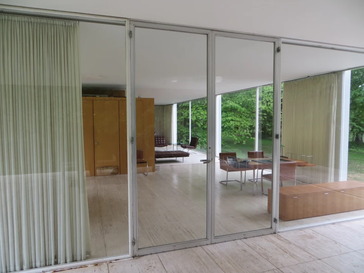 sliding glass doors open to reveal dining room