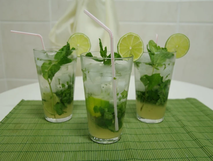 three glasses of mojito with lime and mint