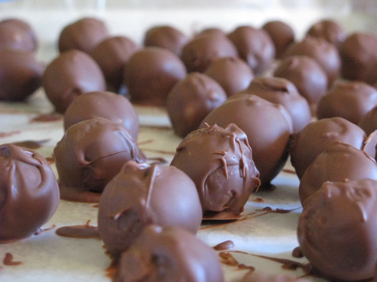 a bunch of chocolate candies that are on top of a counter