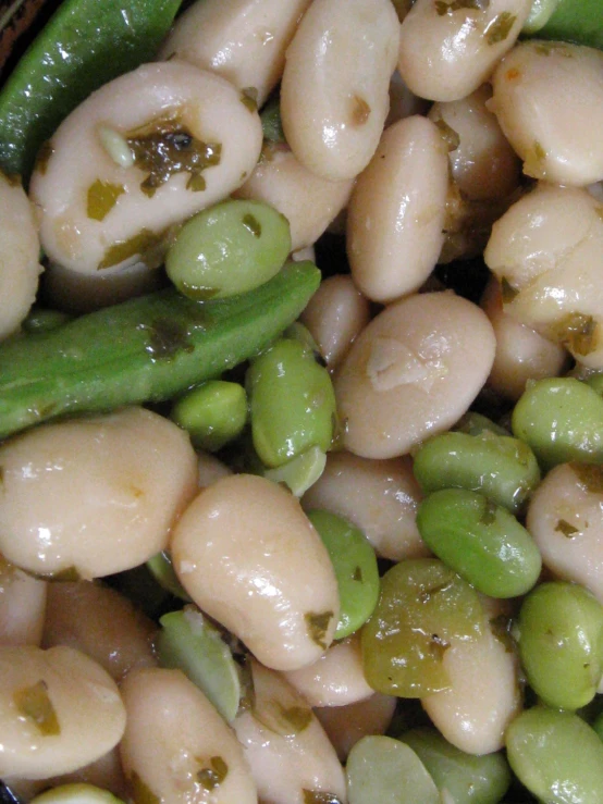 a pile of beans and peas sitting on top of each other