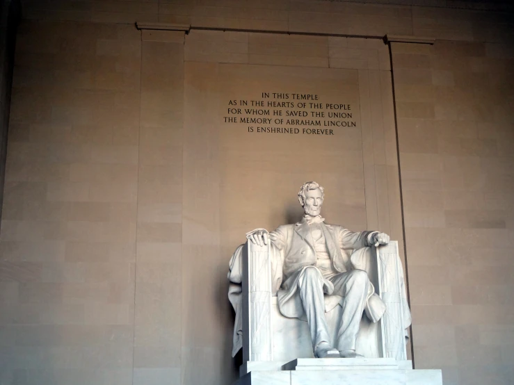 a large statue sitting in front of a building