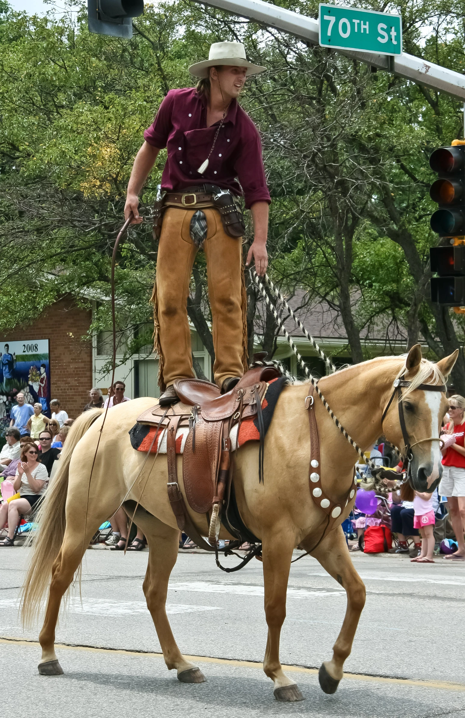 a horse is walking down the street with people