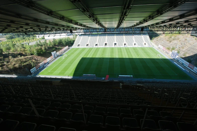 an empty soccer field sits empty in the afternoon