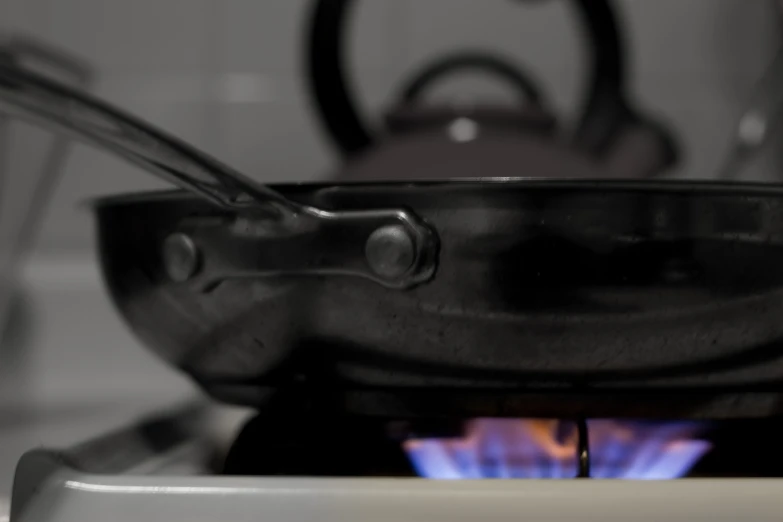 two forks stuck in the pan as they cook