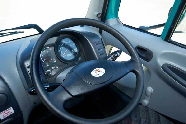 the interior of an empty truck, with dashboard