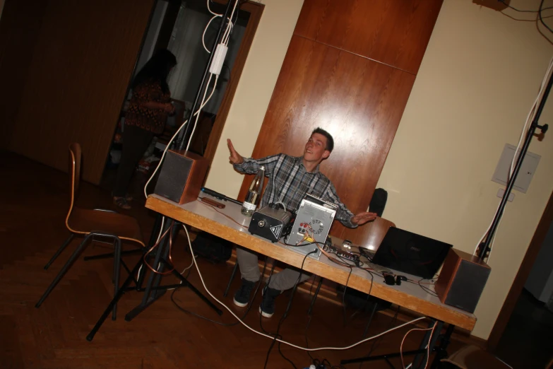 a person that is playing with some wires on a table