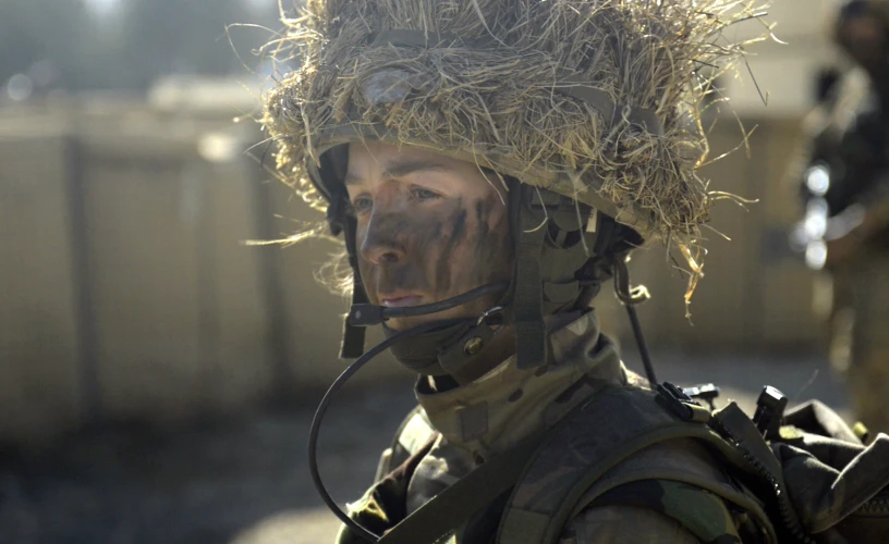 the soldier is wearing hay in his helmet