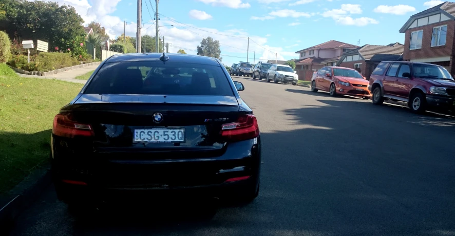 the cars are parked along the side of the street