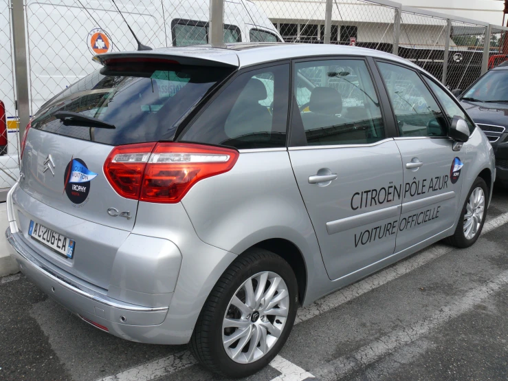 a silver car that has a sky box above it