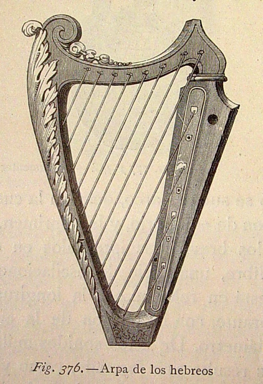 an old book that is open with a drawing of a harp on it