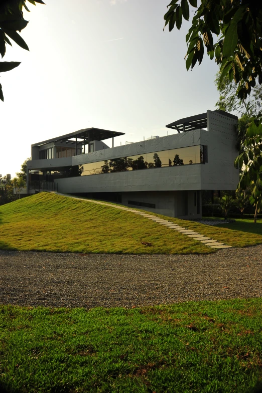 this modern, house with an interesting design sits in the countryside