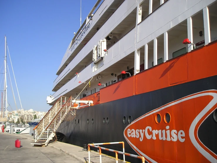 a large cruise ship in front of a pier