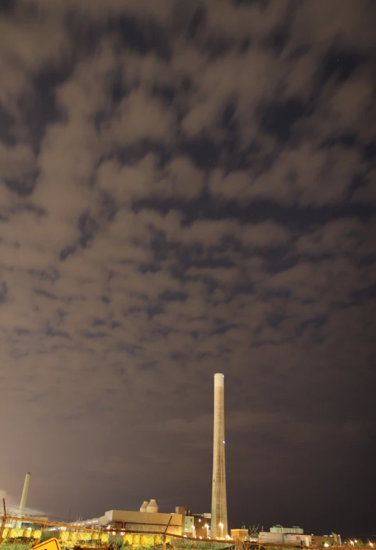 a large light house near a body of water