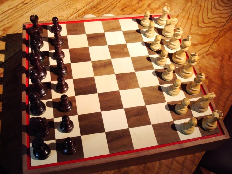 a chess game with black pieces and white pieces