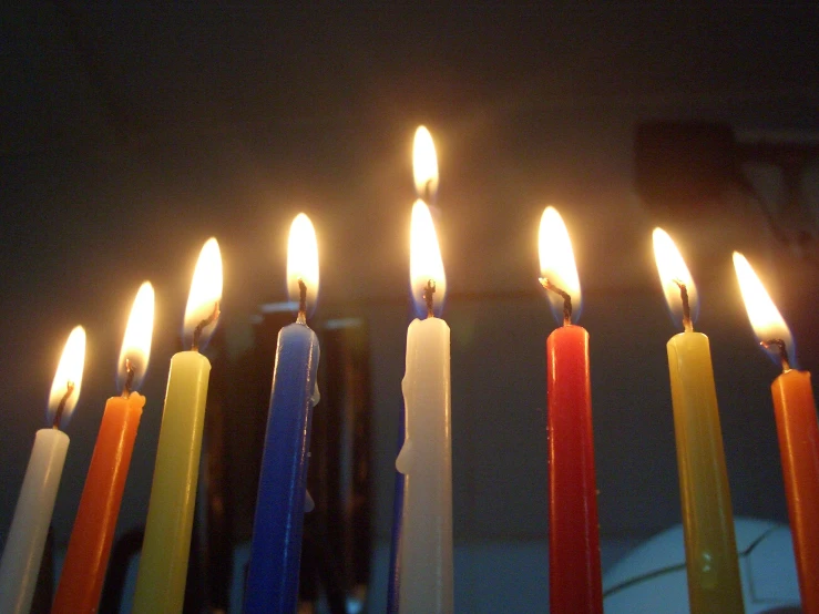 some candles with many different colors and white