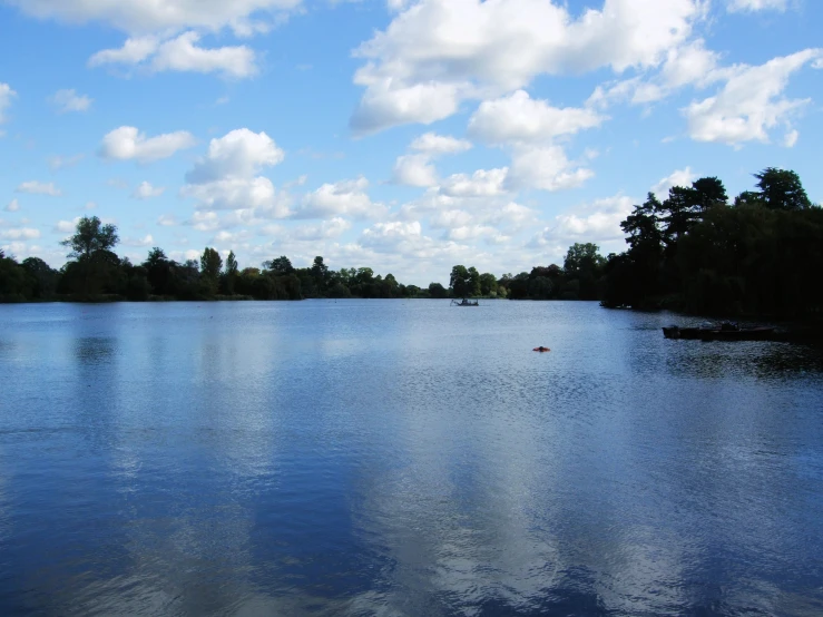 a lake with small boats on it, on the water