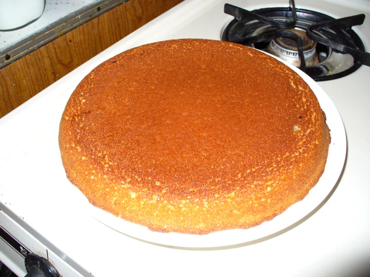 a close up of a cake on a plate on a stove