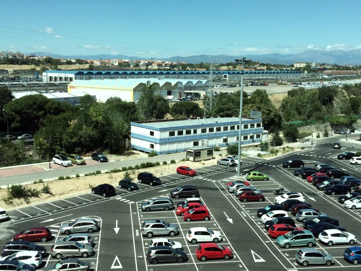 a parking lot with many cars in it