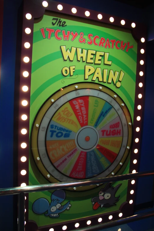 a wheel of pain sign with lots of lights