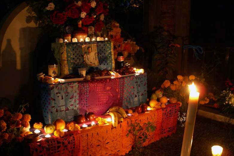 a display is decorated with orange and red candles