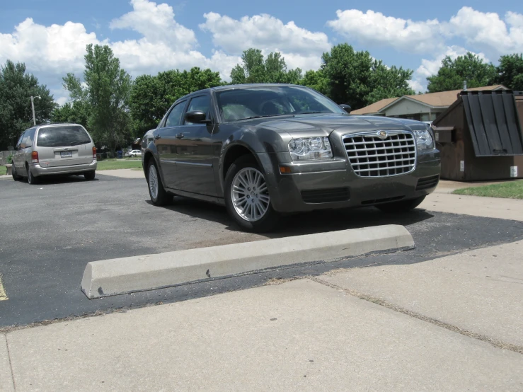 a car parked in a parking lot next to a fire hydrant