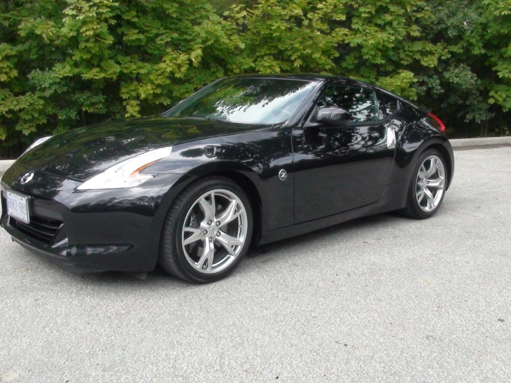 the front end of a black sports car