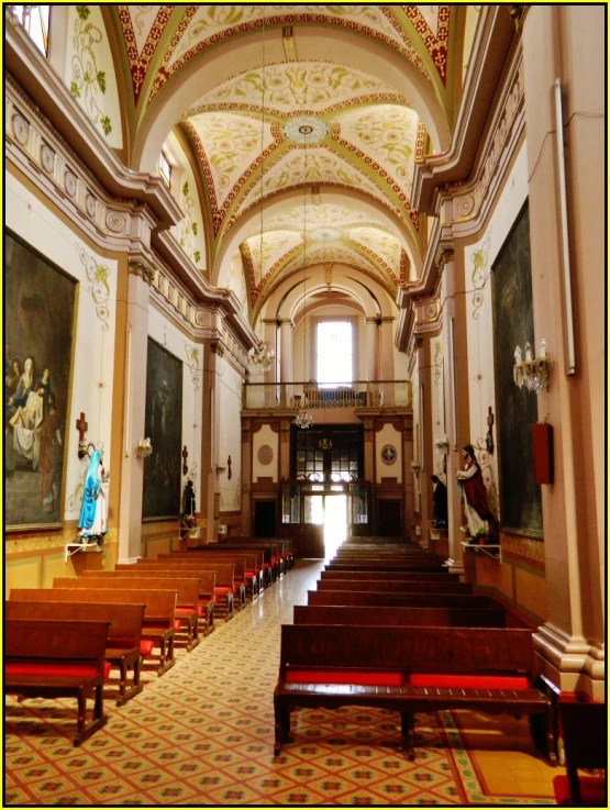 a church with many pews in the center of it