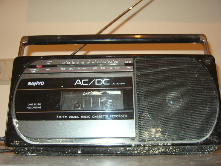 an older style radio is sitting on the desk