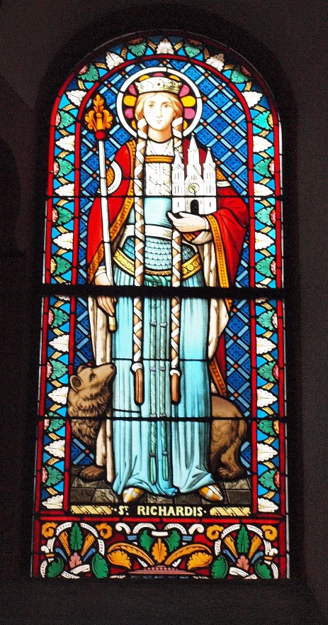 a stained glass window with an image of a man