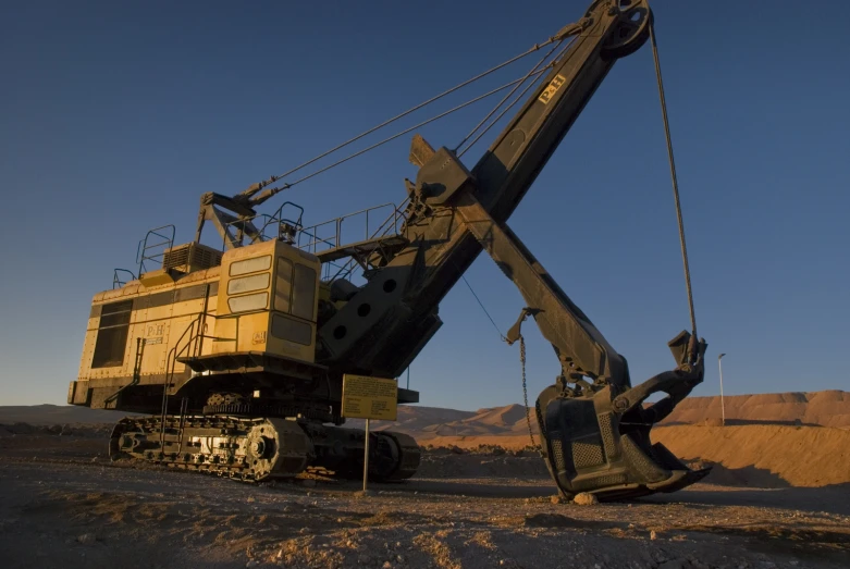 the giant crane is lifting the truck from the ground