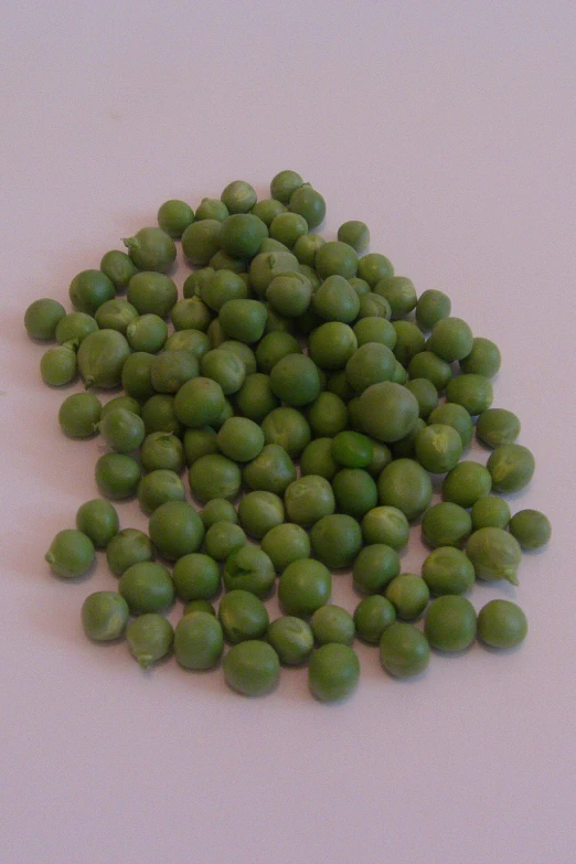 a pile of pea seeds is on display