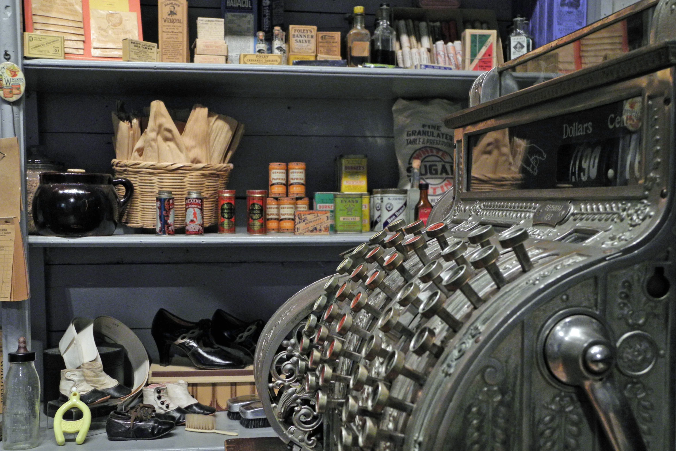 baskets are arranged on open shelves in the kitchen