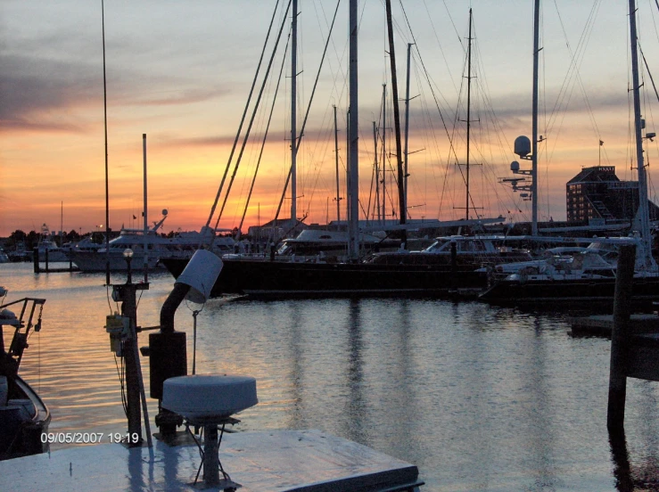 a few white boats parked in a harbor