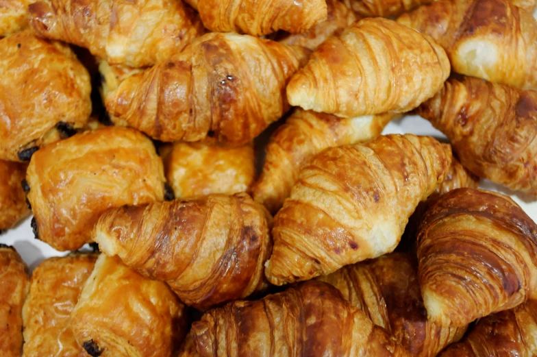 there are many croissants sitting on the table