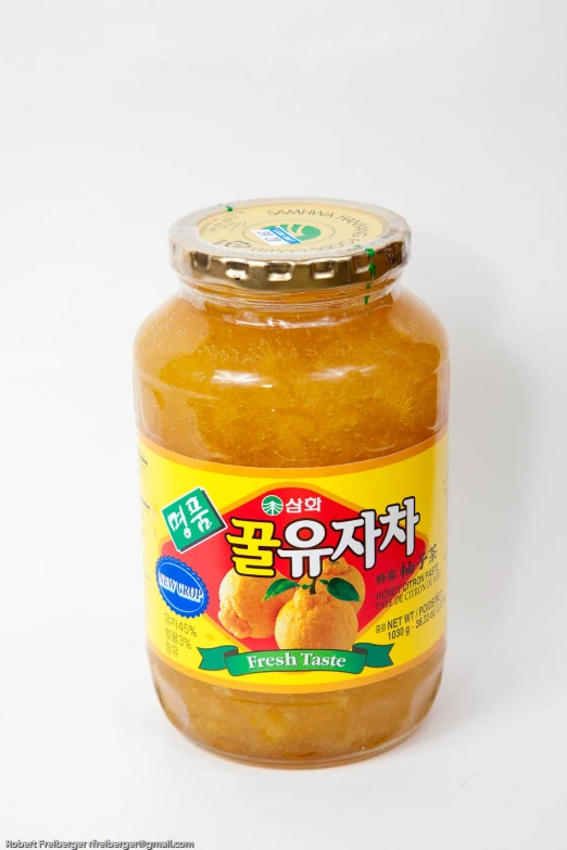 a jar of peach jam, with chinese writing