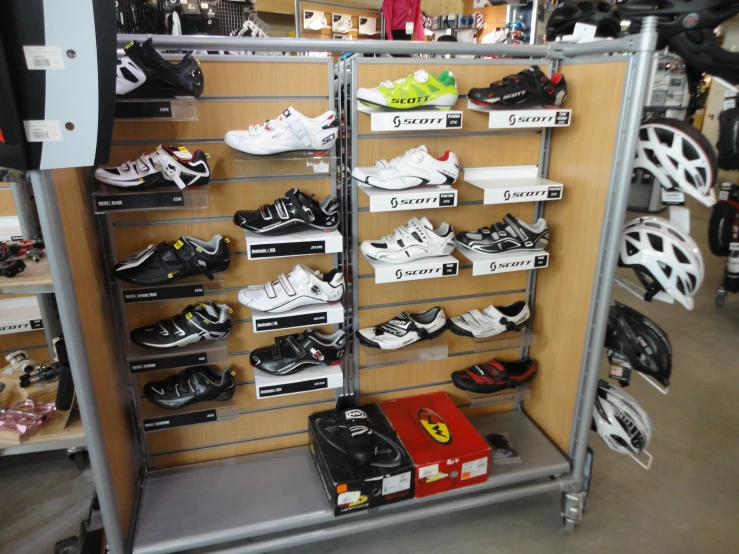 a collection of shoes and helmets in a storage area