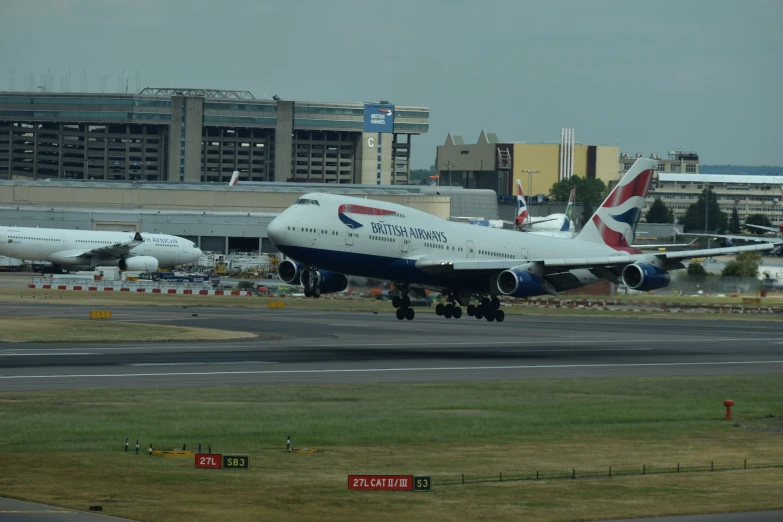 a large jetliner taking off from an airport runway