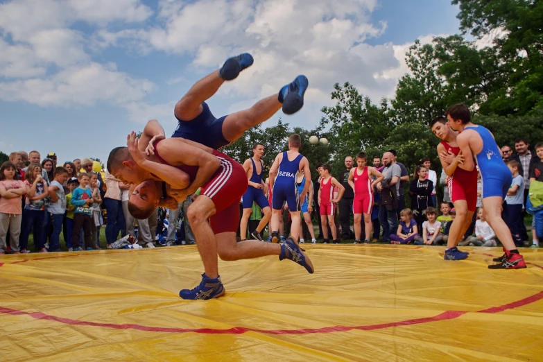 a man performs acrobatic tricks for spectators