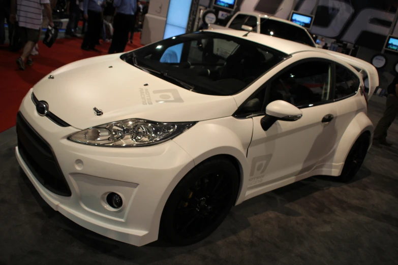 the front end of a white car is displayed