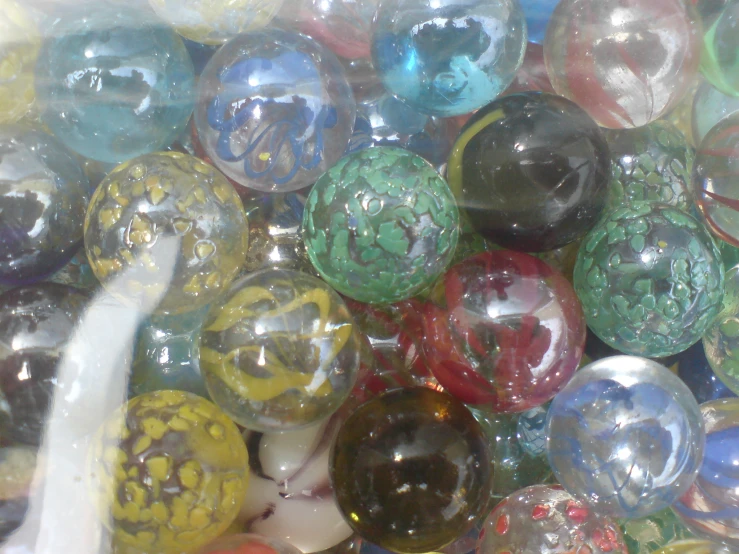 various colorful and shiny balls in a bowl