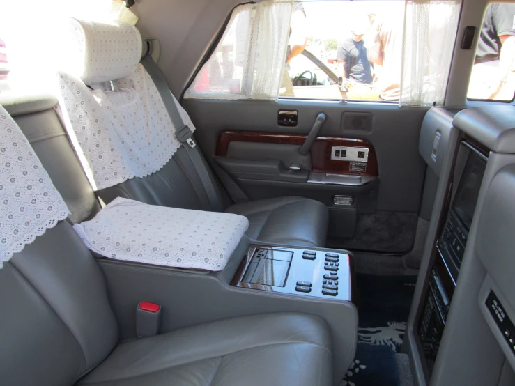 the inside of a car with a lot of leather seats