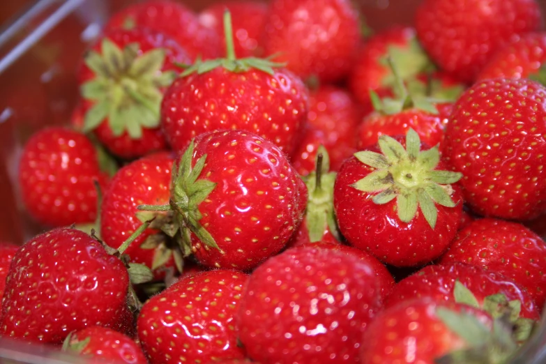 some strawberries in a glass dish ready to be eaten