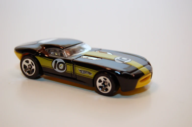 there is a toy car made out of tin