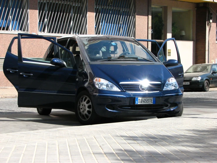 a car is parked on the side of the street