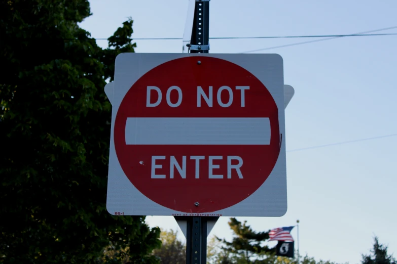 a do not enter sign on a post outside