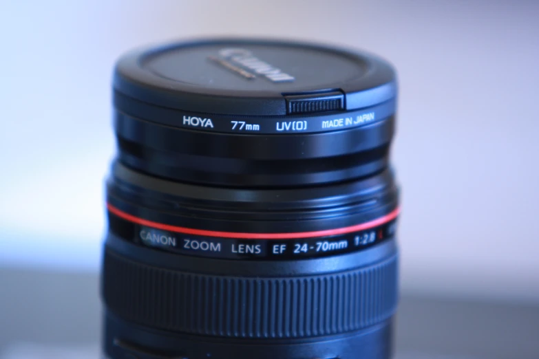 two lens stacked on top of each other with different lens caps