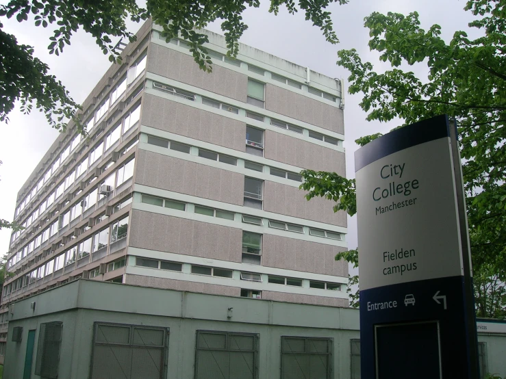 a building sitting in front of a tree