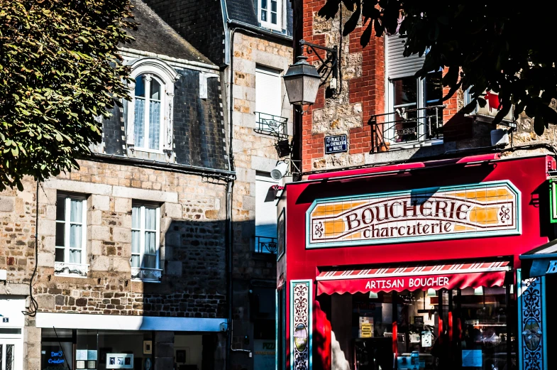 a red store front sitting on the side of a street